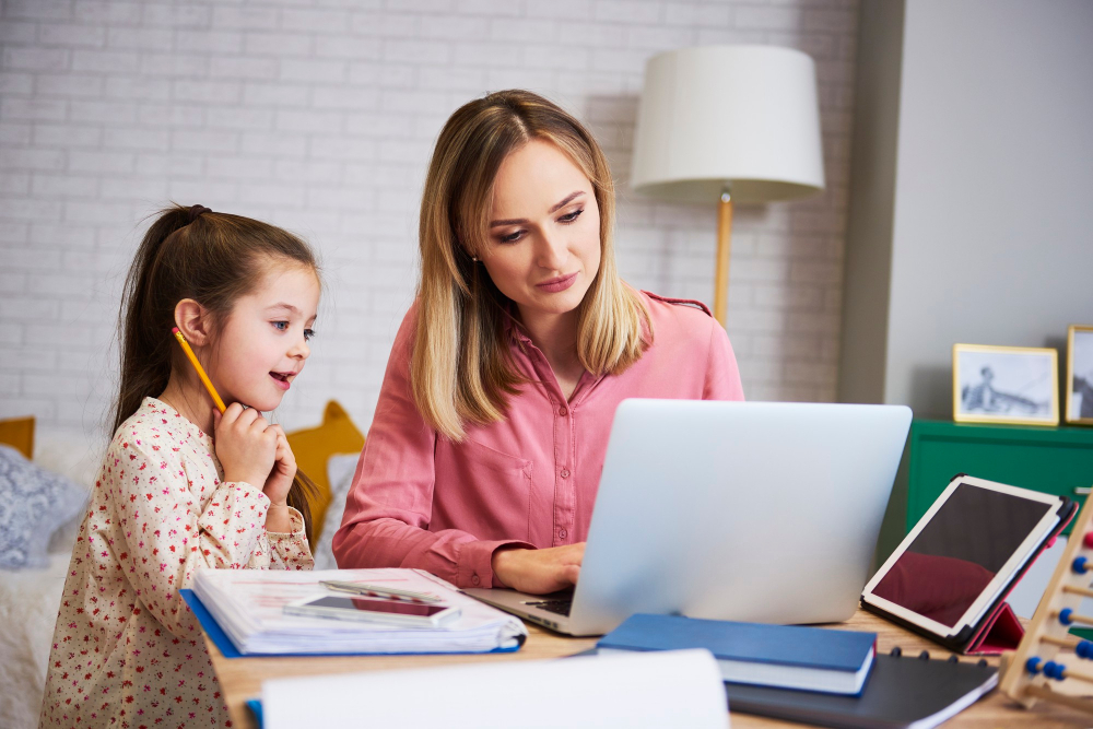 Young female teacher teaching young female student at home